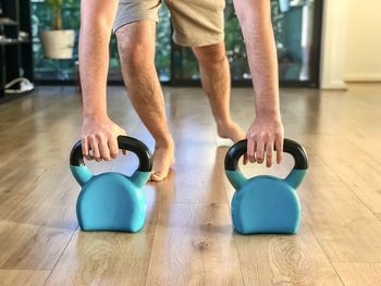 Low section of people on hardwood floor