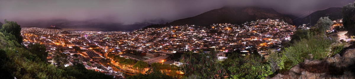 High angle view of illuminated buildings in city