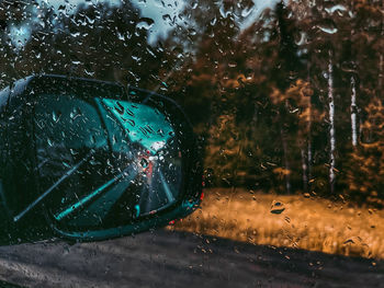 Raindrops on glass window during rainy season