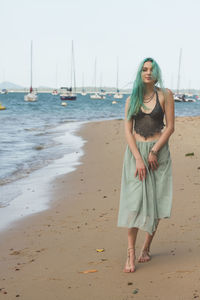 Young woman standing on beach