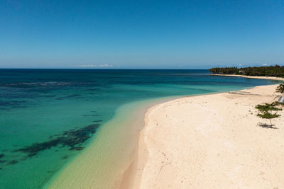 Aerial view of tropical sandy beach and blue sea. pagudpud, ilocos norte philippines