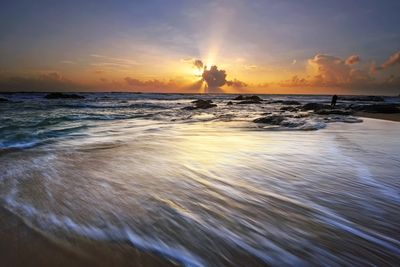 Scenic view of sea against sky during sunset
