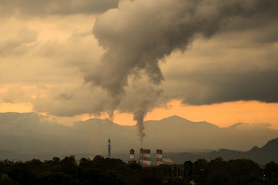 Scenic view of silhouette mountains against sky during sunset