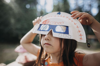 Close-up portrait of girl wearing hat