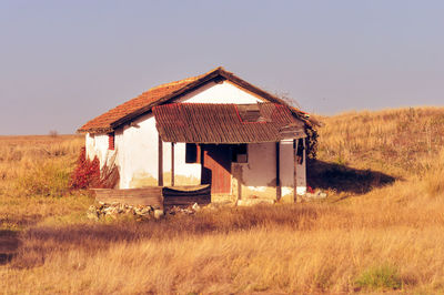 Built structure on field against clear sky