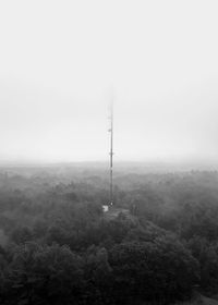 Scenic view of landscape against sky during foggy weather