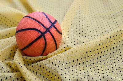 Basketball on patterned fabric