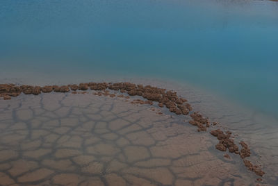 Scenic view of desert against clear blue sky