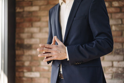 Businessman with folded hands