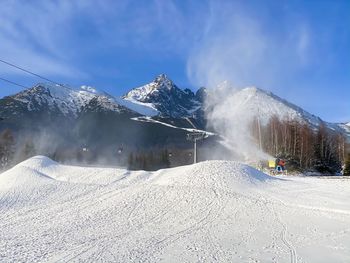 Snow covered mountain against sky