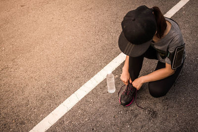 Low section of man with woman on road