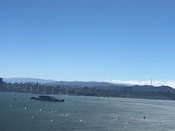 Scenic view of sea against clear blue sky