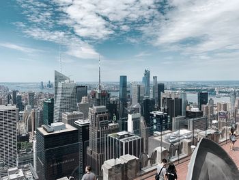 Aerial view of modern buildings in city against sky