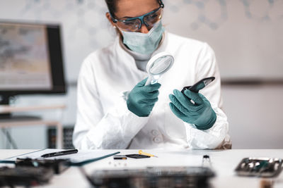 Female scientist working at crime laboratory