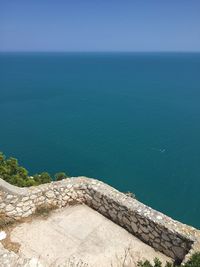 High angle view of sea against blue sky