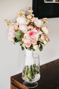 Close-up of roses in vase on table