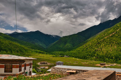 Scenic view of landscape and mountains against sky