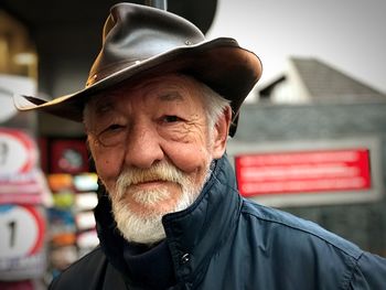 Portrait of senior man wearing hat