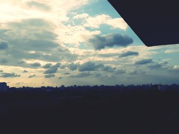 Low angle view of silhouette landscape against sunset sky