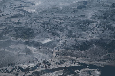 Aerial view of people on mountain against sky
