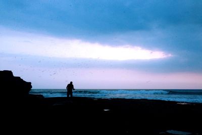 Scenic view of sea against cloudy sky