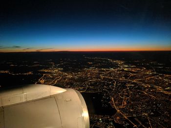 Aerial view of city against blue sky