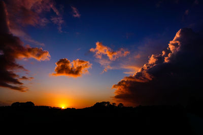 Low angle view of dramatic sky during sunset