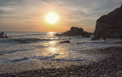 Scenic view of sea against sky during sunset