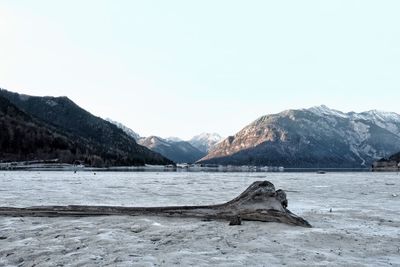 Frozen lake at tyrol against sky