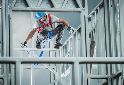 Man working on railing