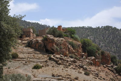 Rock formations on landscape against sky
