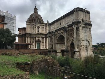 Historic building against cloudy sky