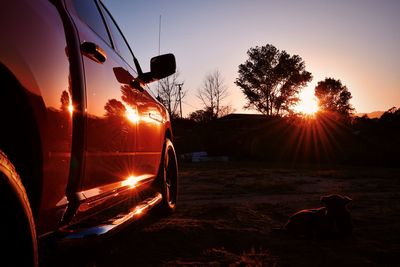 Sports utility vehicle at sunset