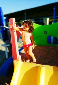 Full length of girl standing in garden