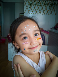 Close-up portrait of girl at home