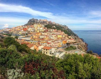 High angle view of town by sea