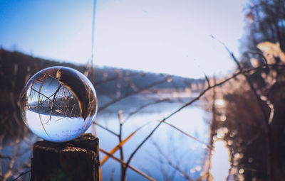 Close-up of crystal ball on snow