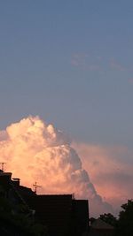 Low angle view of buildings against sky at sunset