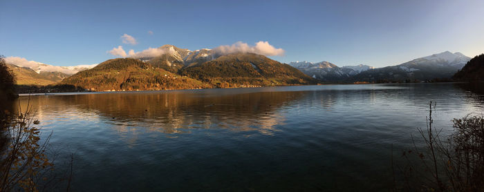 Scenic view of lake and mountains against sky