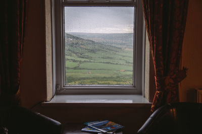 View of landscape seen through window