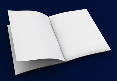 Close-up of open book against black background