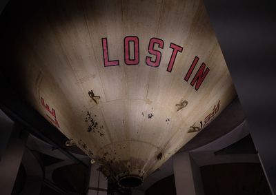 Low angle view of text on ceiling