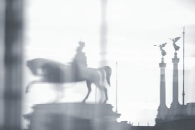 View of statue against sky in city