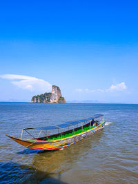 Scenic view of sea against blue sky