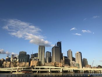 Modern buildings in city against sky