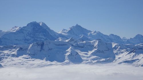 Scenic view of snow covered mountains