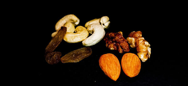 Close-up of fruits against black background