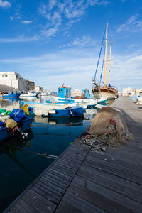 Boats moored at harbor