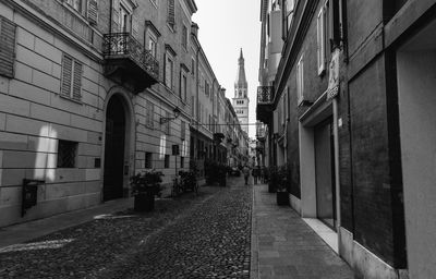 Street amidst buildings against sky