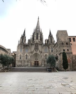 Facade of historic building against clear sky